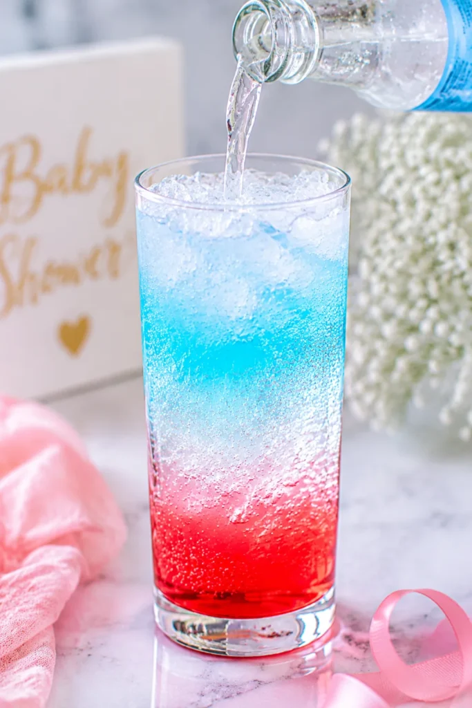 “Club soda being poured slowly over syrup and ice, layers starting to form in glass.”