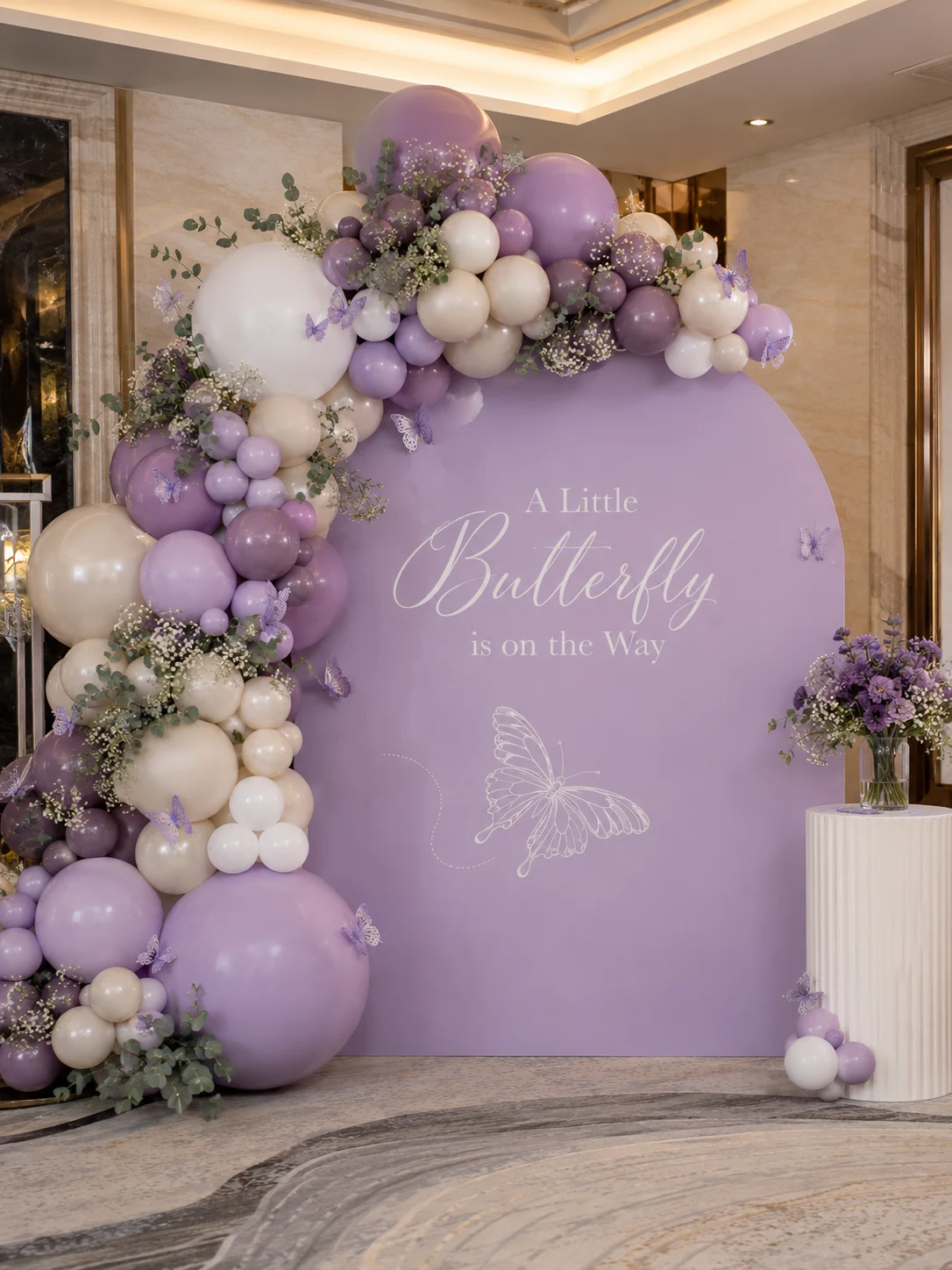 Purple butterfly baby shower setup.